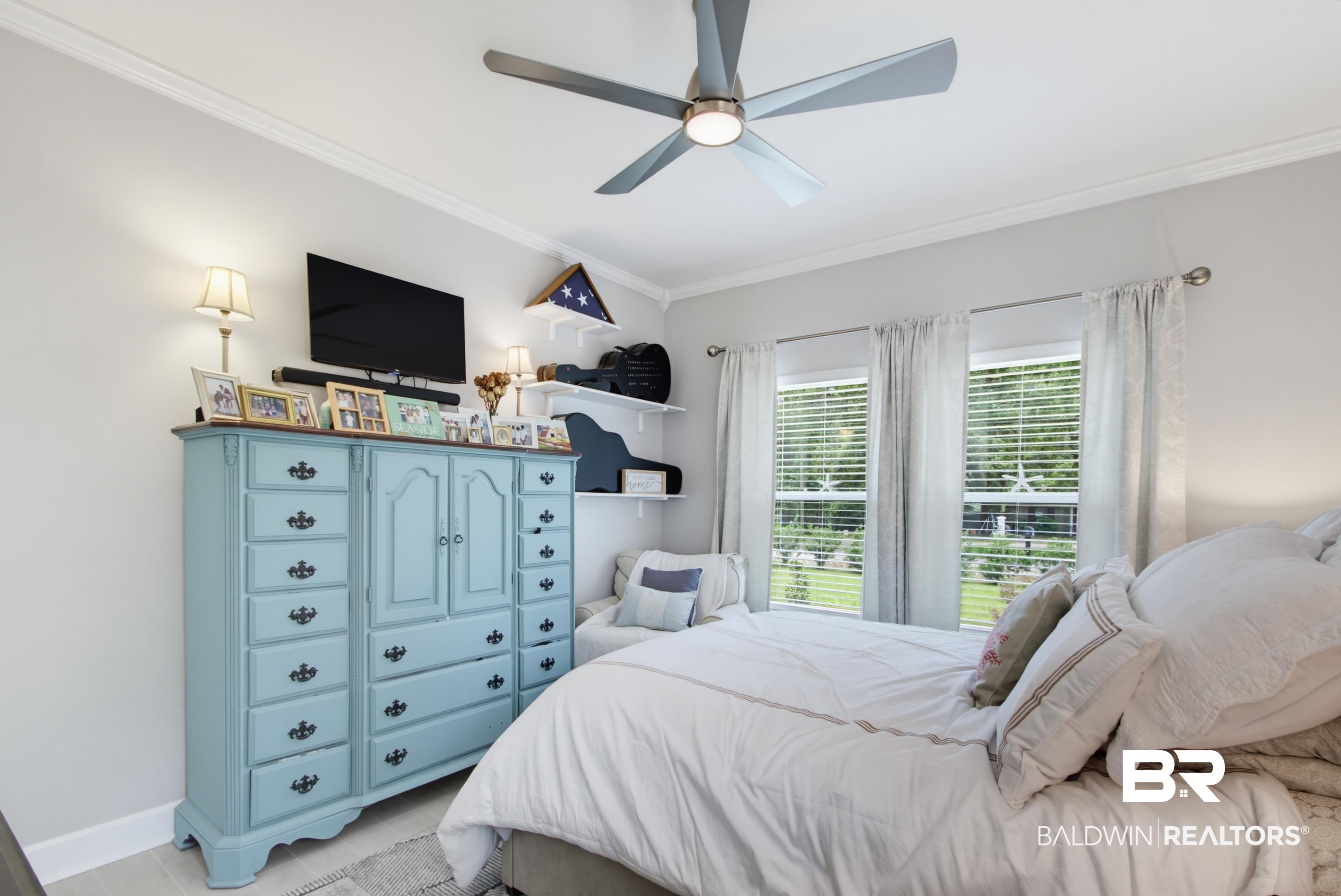 7472 Coopers Landing Road Foley, AL 36535 - Photo 18 of 40 Bedroom featuring a contemporary ceiling fan with integrated lighting, crown molding, and light-toned walls
