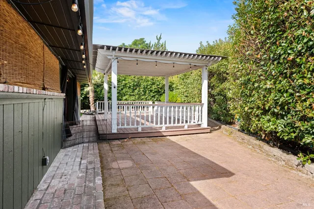 a view of a deck with a wooden fence