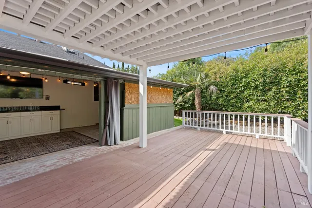 a view of backyard with a deck