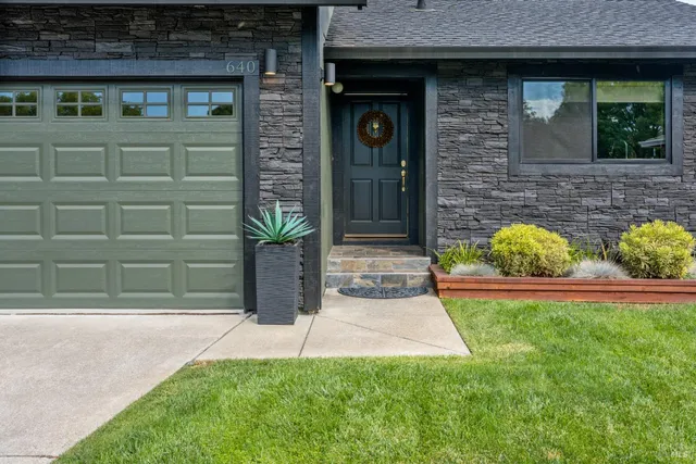 a front view of a house with garden