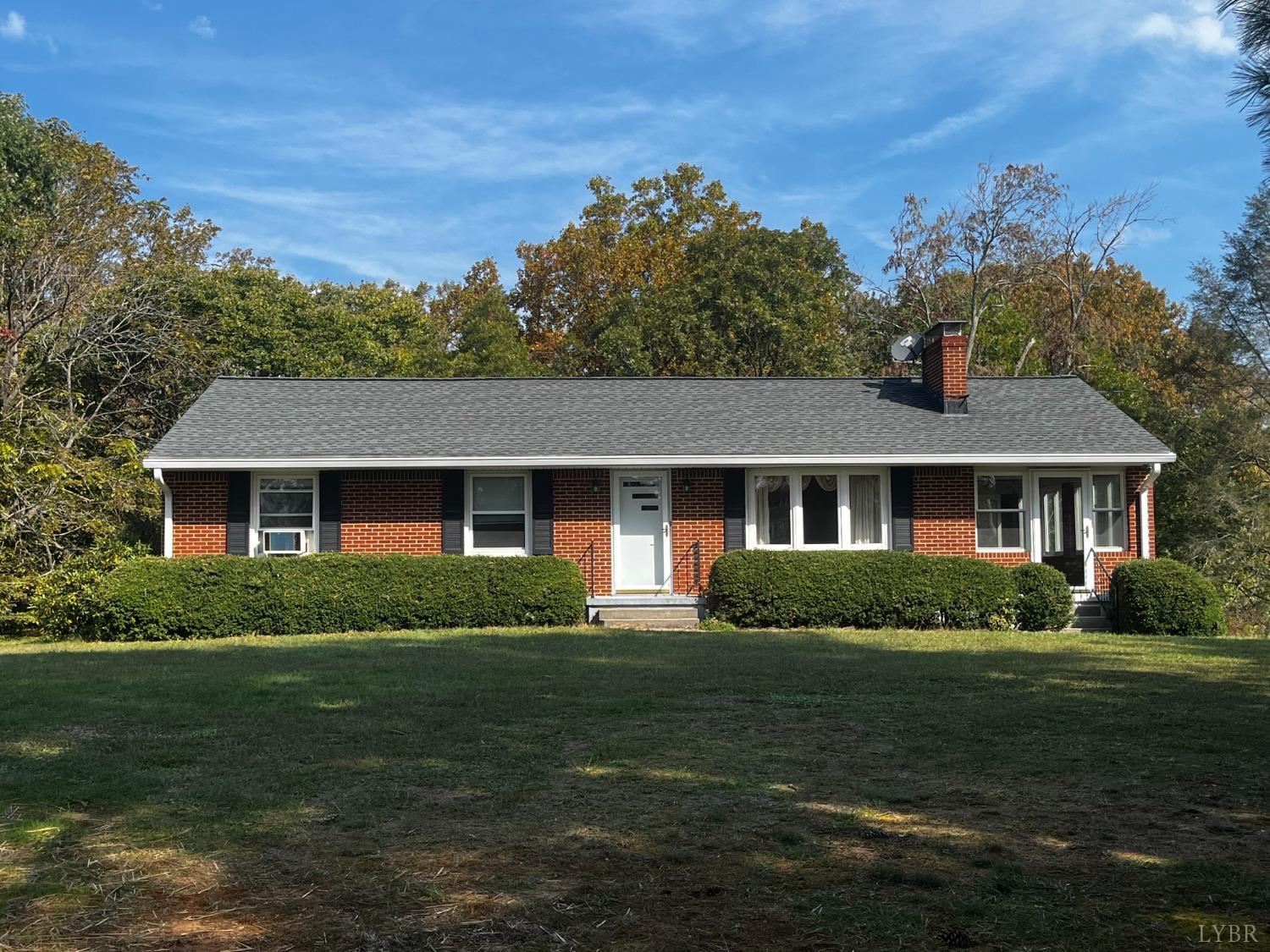 1089 Howell Ridge Lane Vinton, VA 24179 - Photo 1 of 39 a front view of a house with a garden