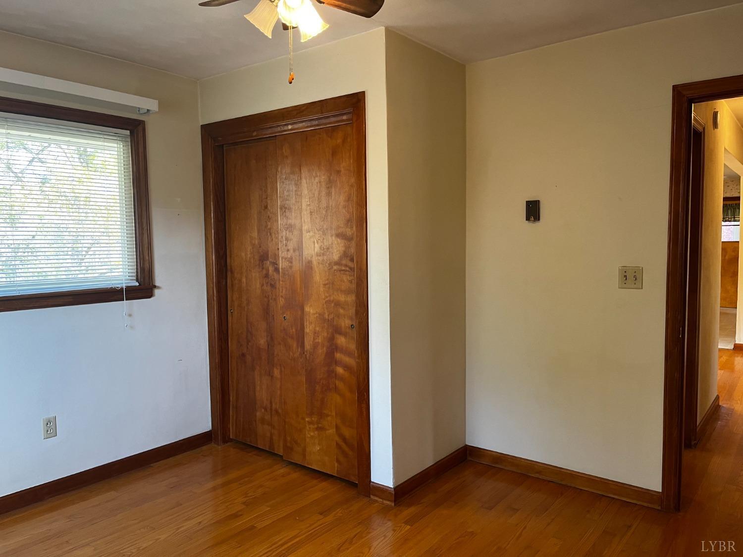 1089 Howell Ridge Lane Vinton, VA 24179 - Photo 15 of 39 a view of an empty room with window and wooden floor
