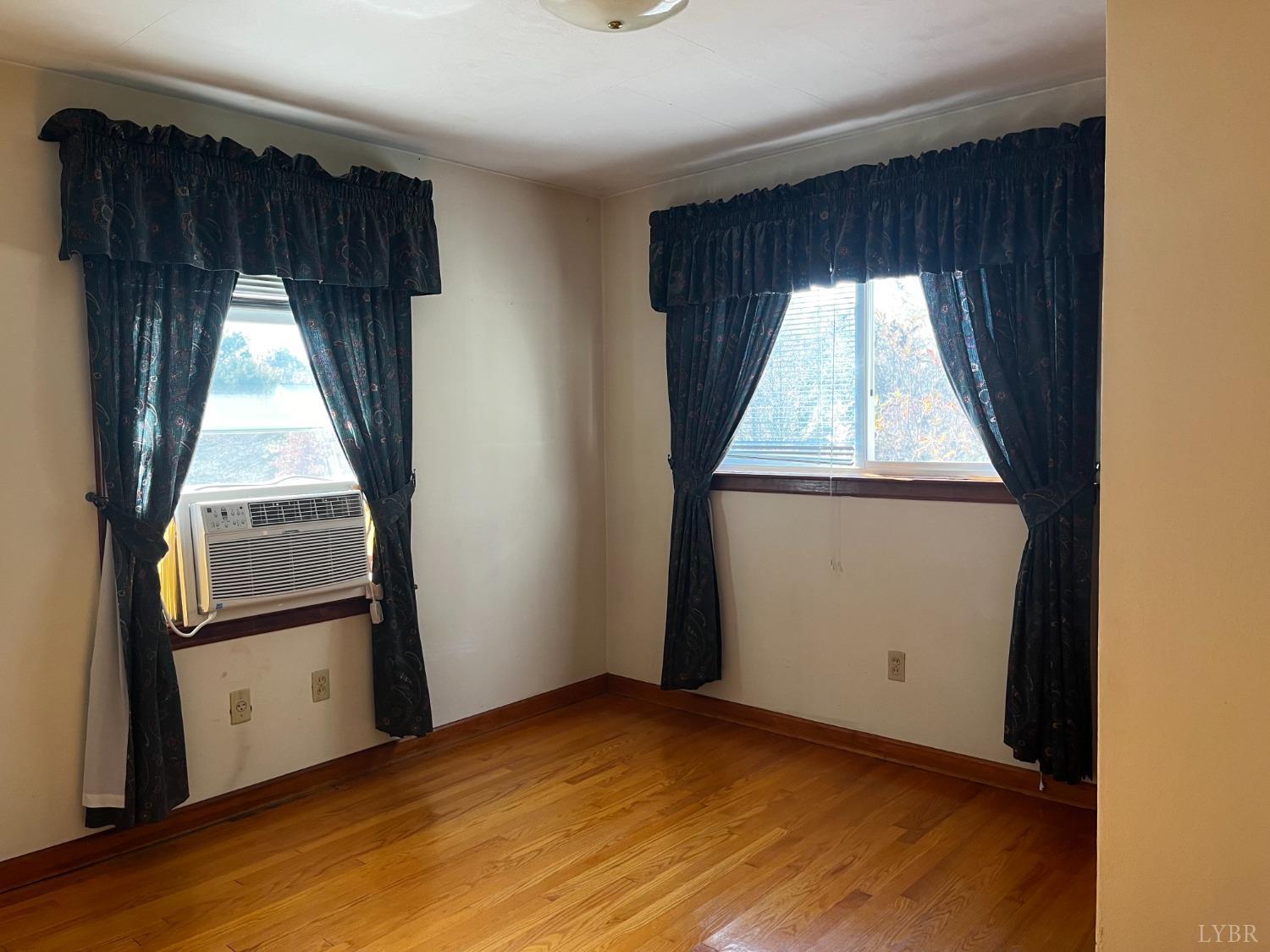 1089 Howell Ridge Lane Vinton, VA 24179 - Photo 16 of 39 an empty room with wooden floor and a window