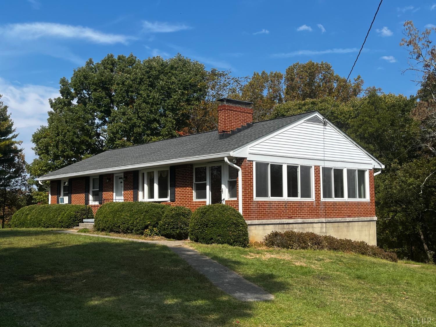 1089 Howell Ridge Lane Vinton, VA 24179 - Photo 2 of 39 a front view of a house with a yard