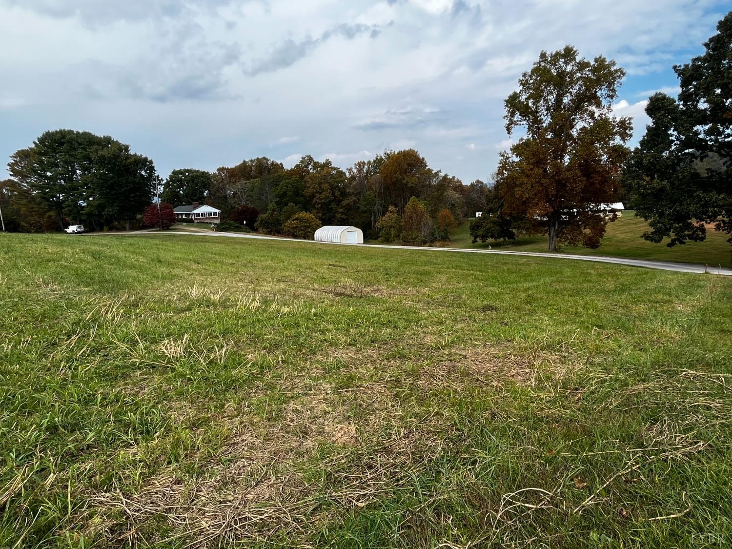 1089 Howell Ridge Lane Vinton, VA 24179 - Photo 38 of 39 a view of a field of grass and trees