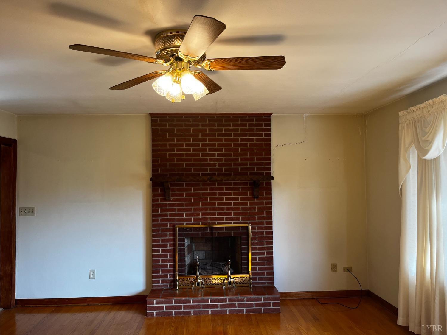 1089 Howell Ridge Lane Vinton, VA 24179 - Photo 4 of 39 a living room with furniture and a fireplace
