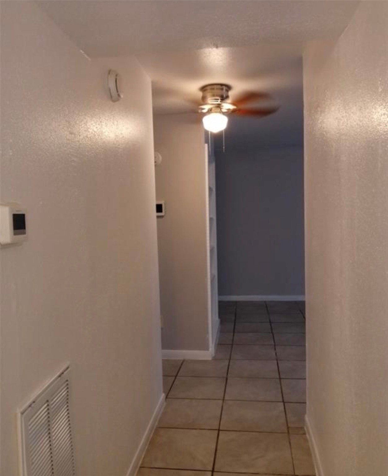 5625 Antoine Drive, Unit 413 Houston, TX 77091 - Photo 6 of 14 a view of an empty room with wooden floor