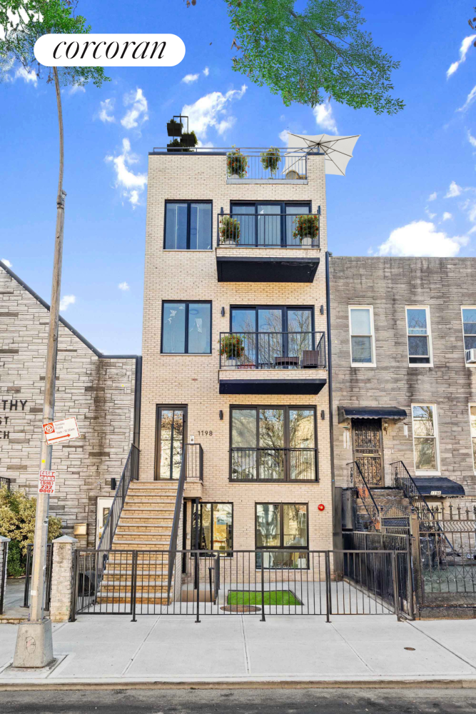 1198 Jefferson Avenue, Unit C Brooklyn, NY 11221 - Photo 11 of 24 a front view of a building with glass windows