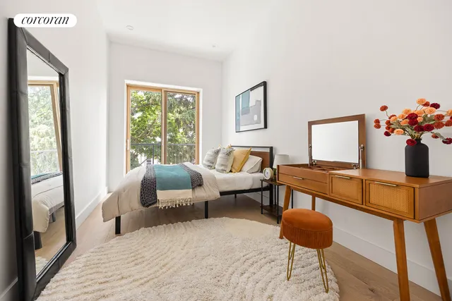 a view of a balcony with chairs and wooden floor