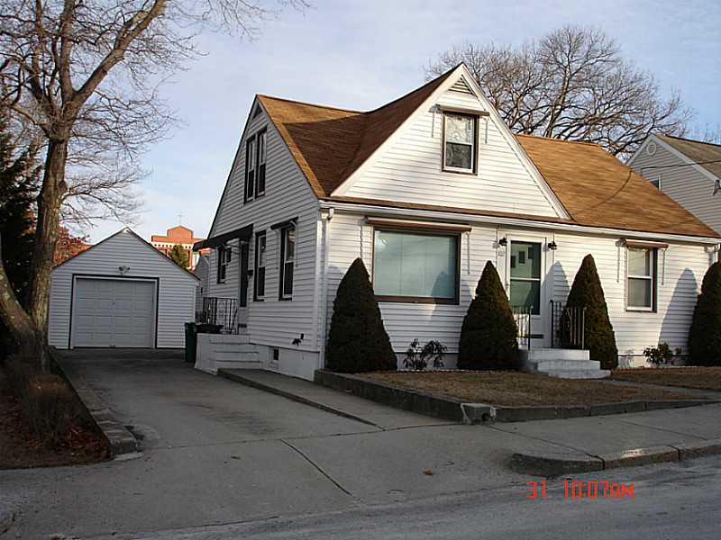 102 Monroe Street Woonsocket, RI 02895 - Photo 2 of 18 Exterior Front. Concrete driveway with detached garage.
