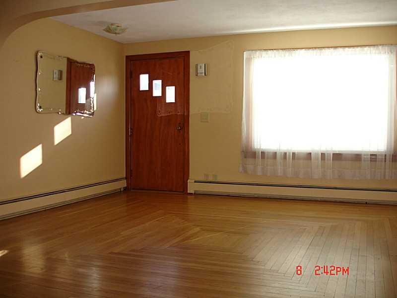102 Monroe Street Woonsocket, RI 02895 - Photo 3 of 18 Living Room. Beautiful hardwoods are feature of large living room.