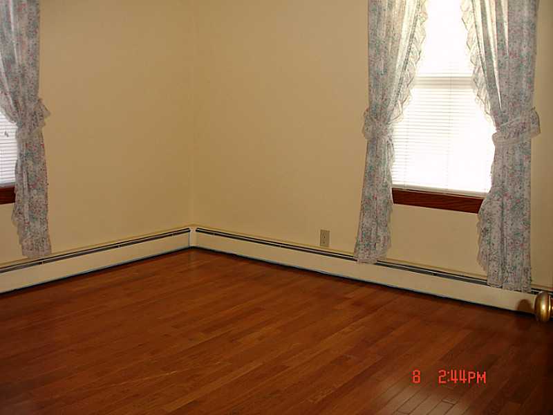 102 Monroe Street Woonsocket, RI 02895 - Photo 5 of 18 Bedroom. Two spacious bedrooms on first floor with beautiful hardwoods and large closets.