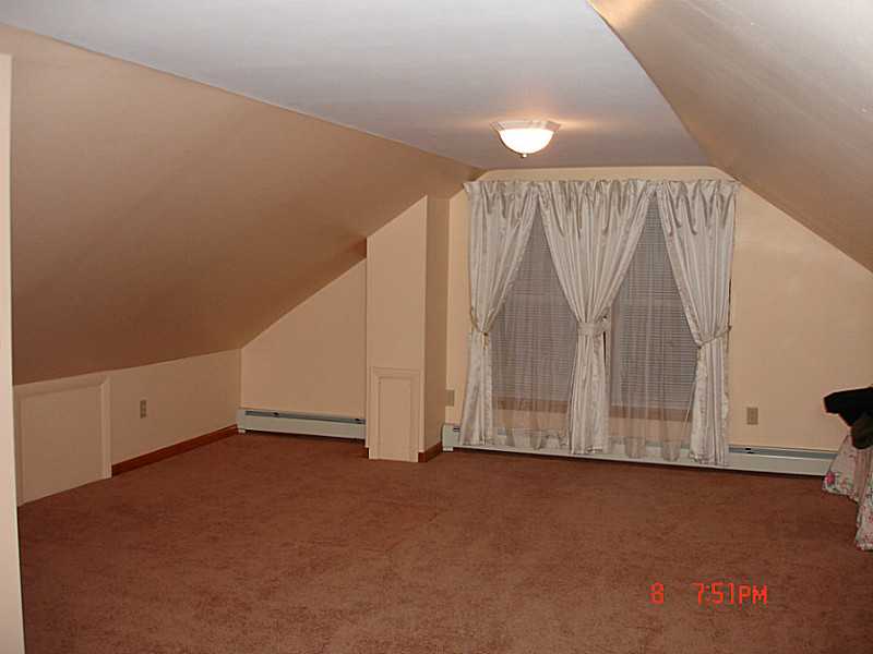 102 Monroe Street Woonsocket, RI 02895 - Photo 7 of 18 Bedroom. Huge upstairs bedroom could easiliy be converted to 2 bedrooms.