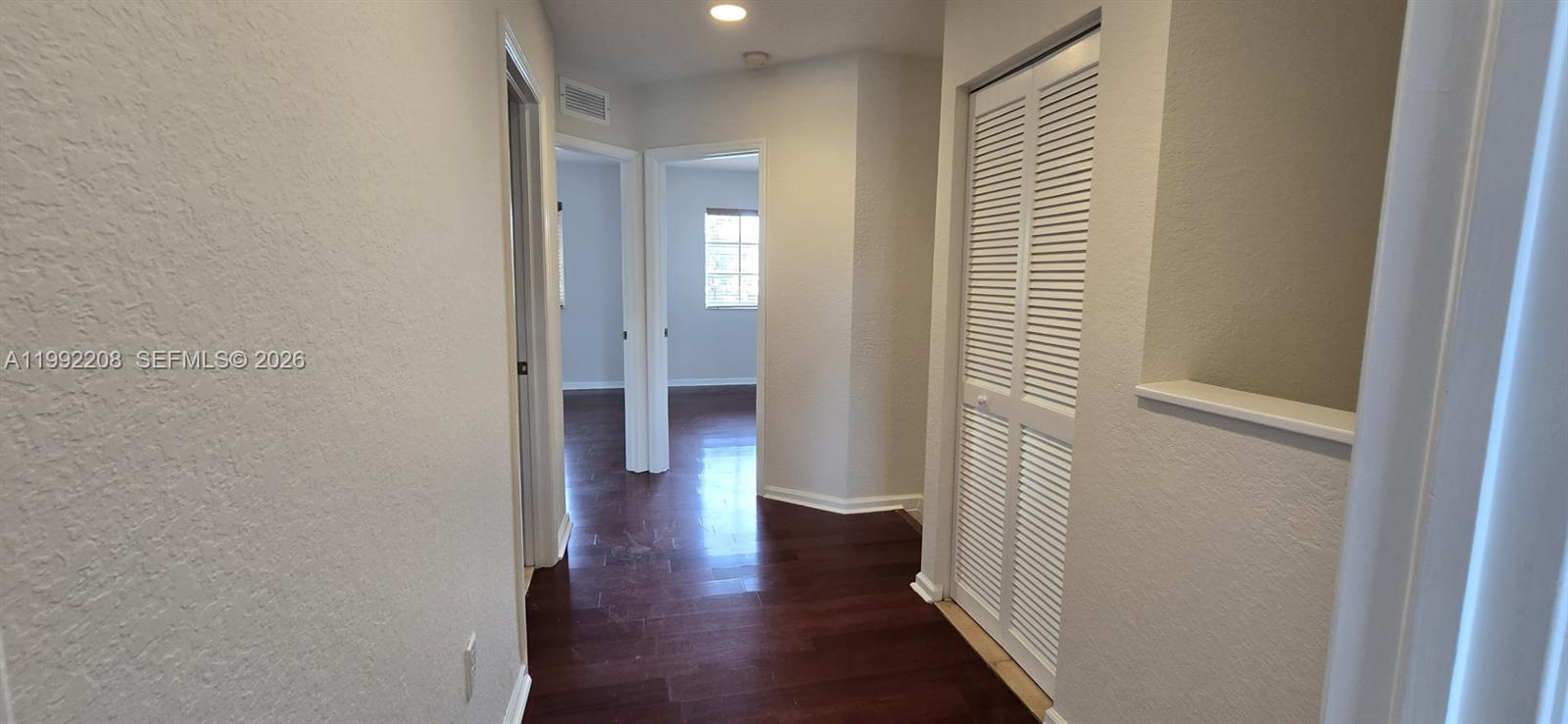 14067 Southwest 272nd Street Homestead, FL 33032 - Photo 22 of 36 a view of a hallway with wooden floor