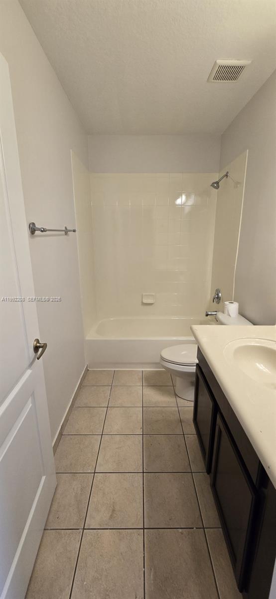 14067 Southwest 272nd Street Homestead, FL 33032 - Photo 23 of 36 a bathroom with a sink a toilet and a mirror