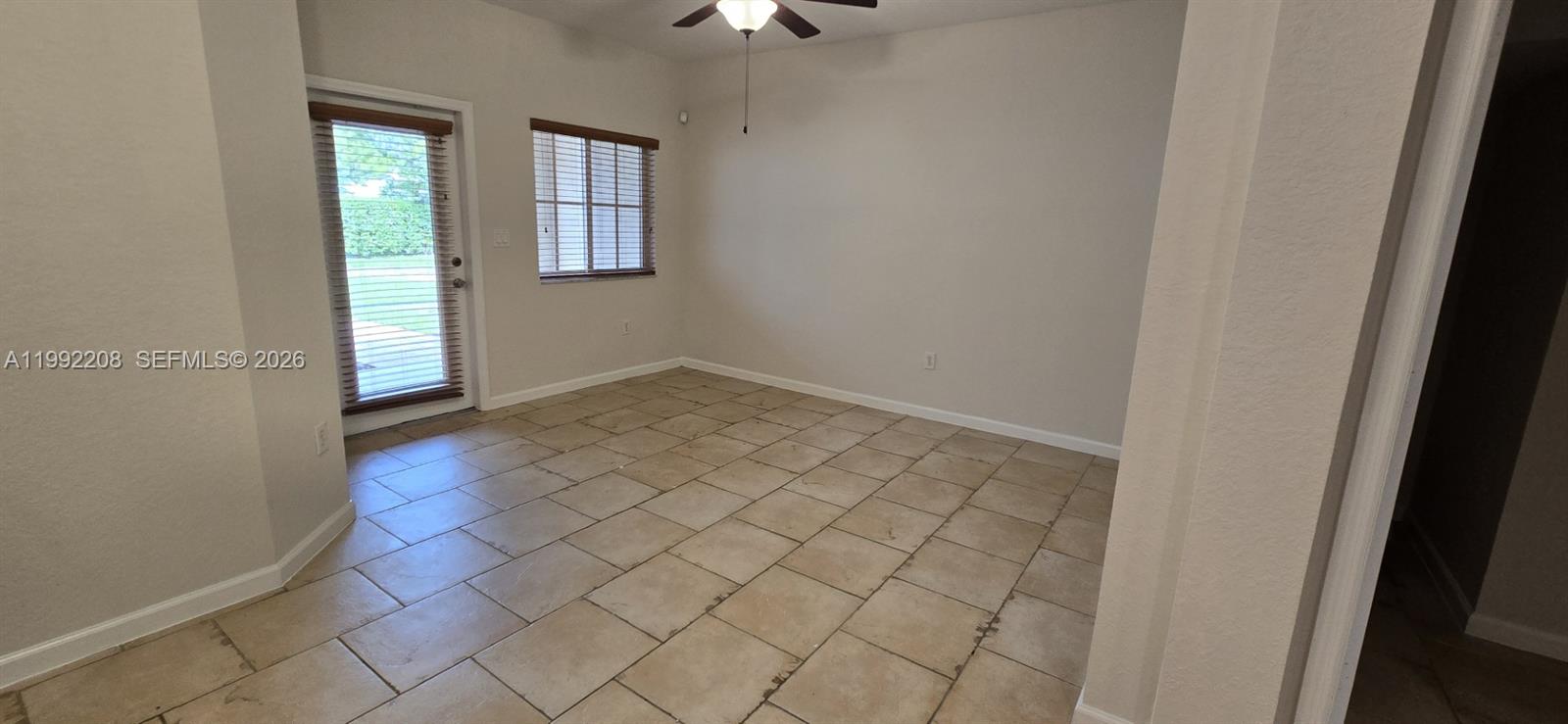 14067 Southwest 272nd Street Homestead, FL 33032 - Photo 24 of 36 an empty room with windows