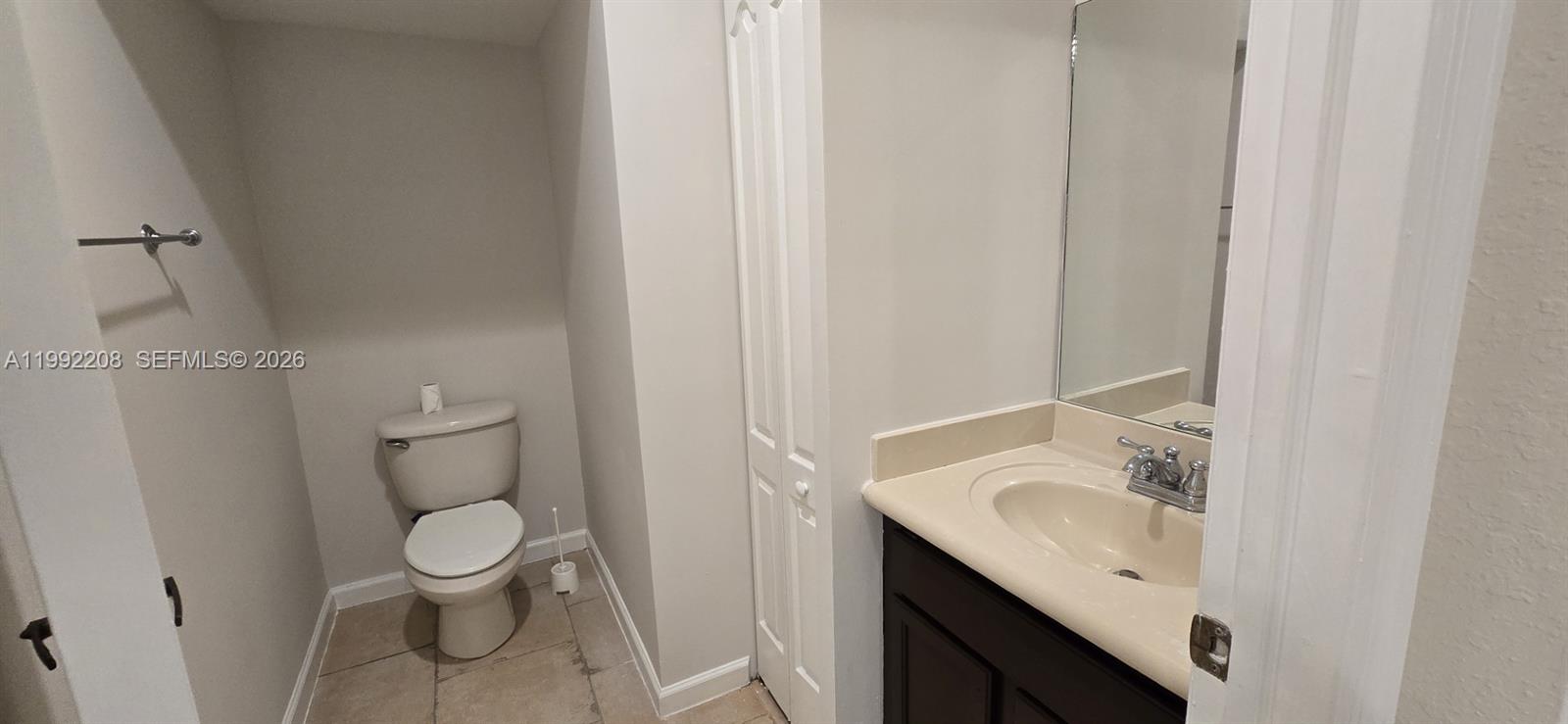 14067 Southwest 272nd Street Homestead, FL 33032 - Photo 25 of 36 a bathroom with a granite countertop sink toilet and shower