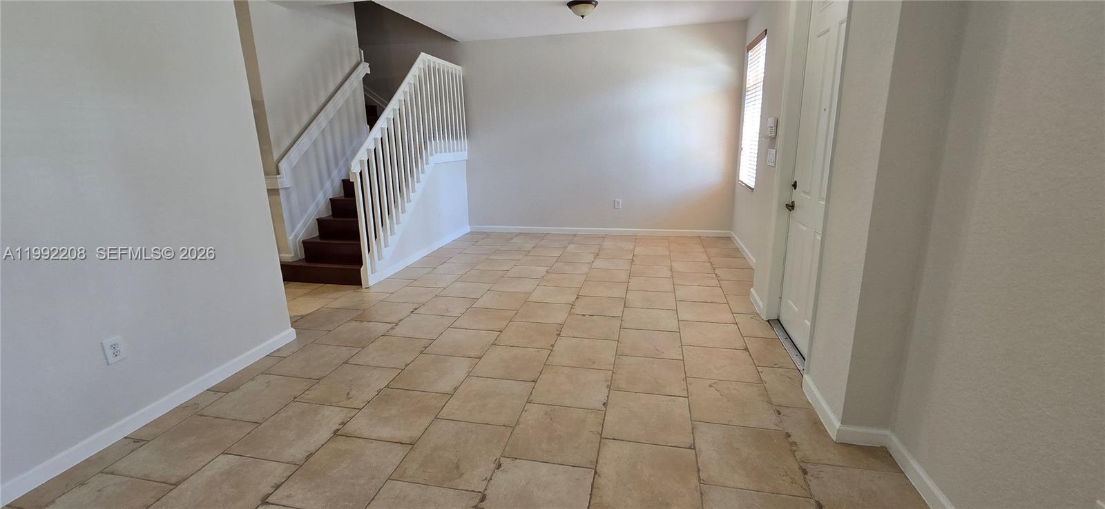 14067 Southwest 272nd Street Homestead, FL 33032 - Photo 5 of 36 a view of a hallway with entryway