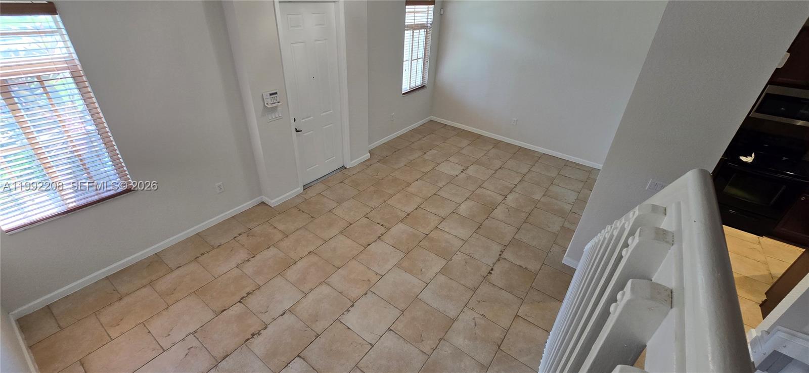 14067 Southwest 272nd Street Homestead, FL 33032 - Photo 7 of 36 a view of an empty room and window