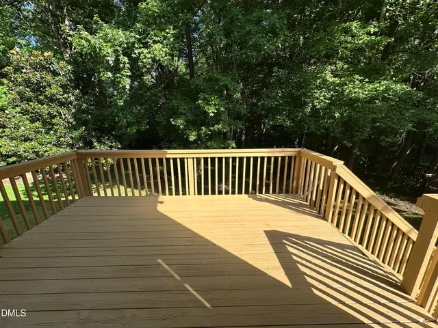 a view of balcony with wooden floor