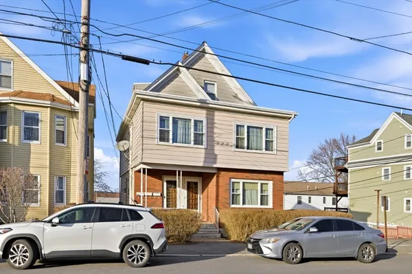 a car parked in front of a house