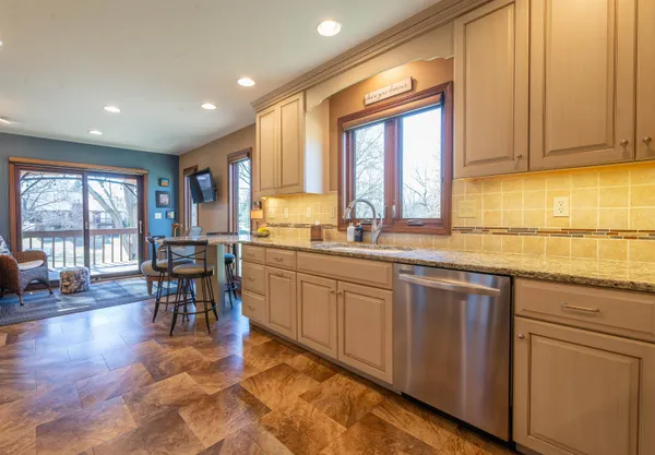 a kitchen with lots of counter top space and dining table
