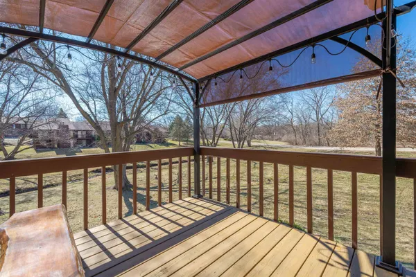 a balcony with wooden floor