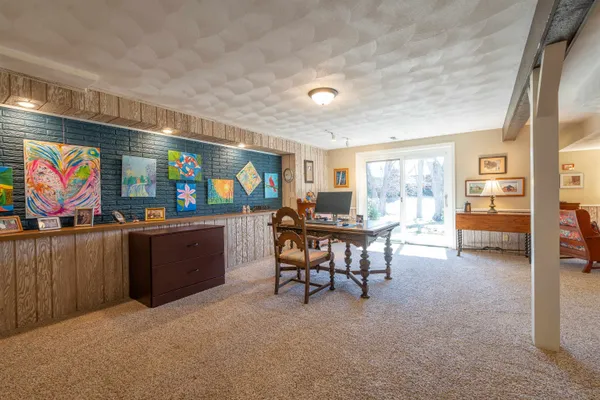 a view of a room with furniture and window