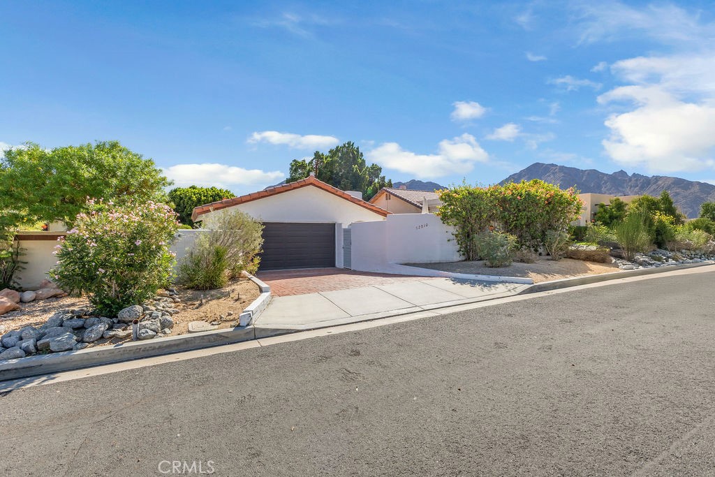 a view of a house with a street