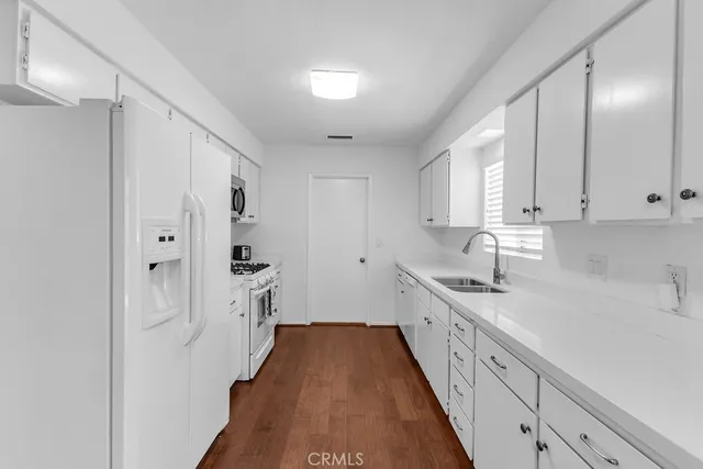 a kitchen with cabinets and a sink
