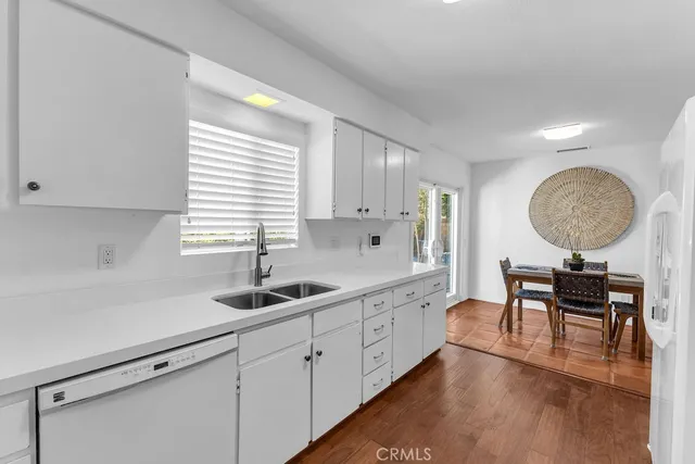 a kitchen with sink cabinets and window