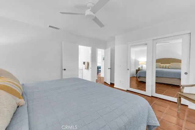 a bedroom with a bed and a walk in closet