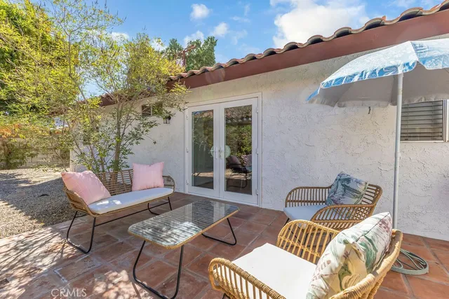 a outdoor living space with furniture and a potted plant