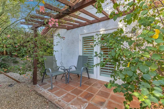 a couple of table and chair in a patio