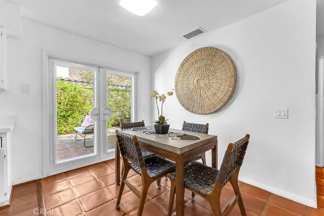 a view of a dining room with furniture and window