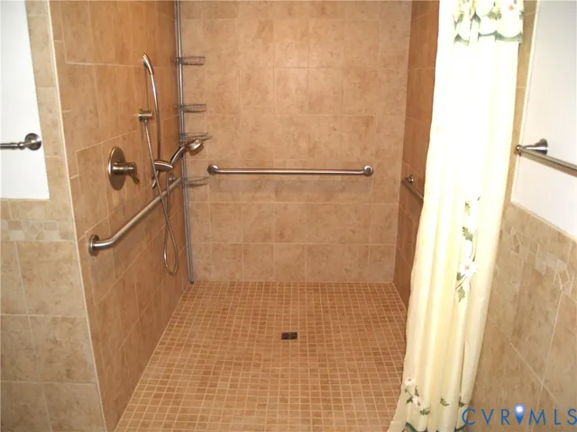 a view of a room with wooden floor and cabinet