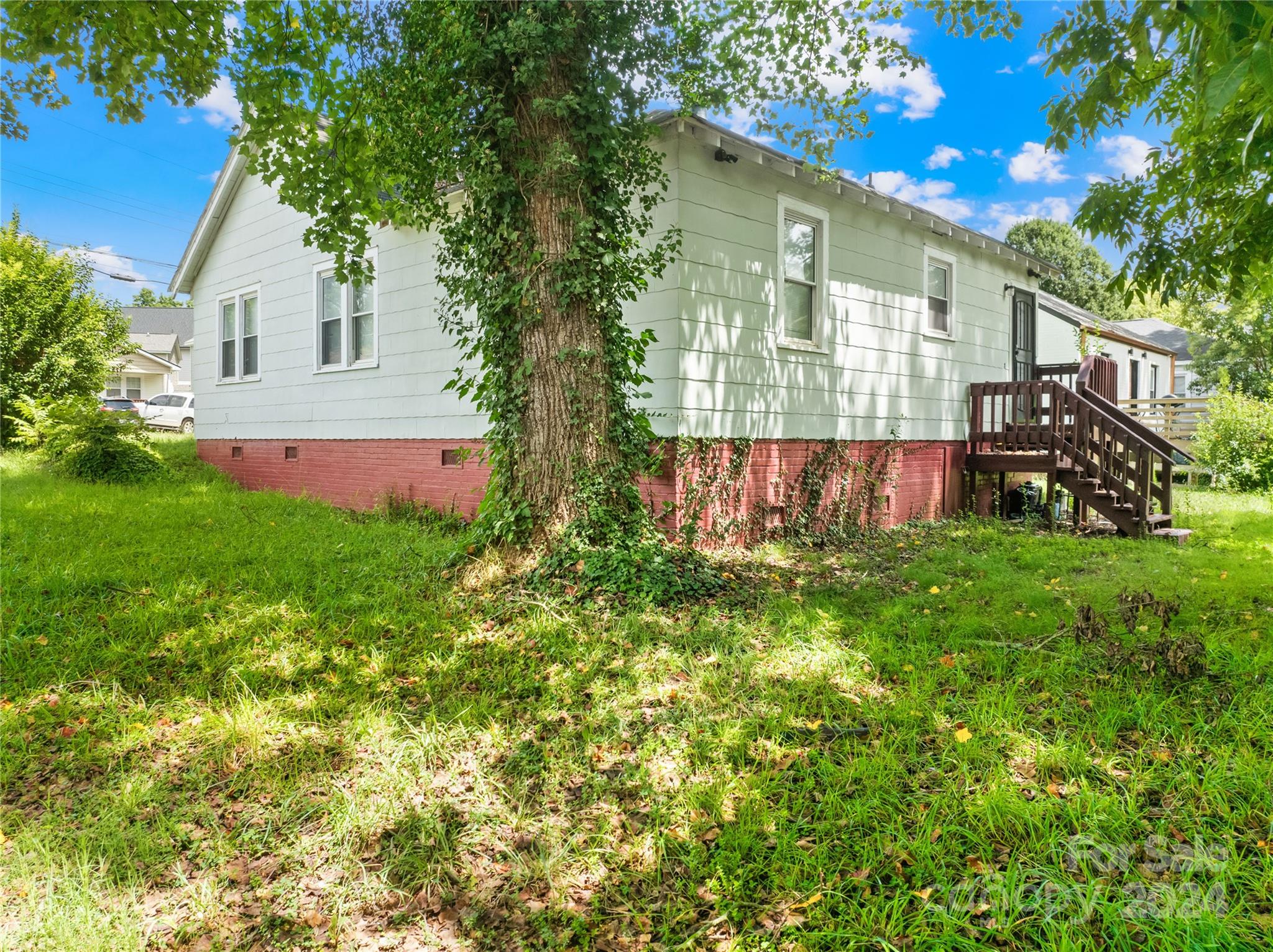 1247 Effingham Road Charlotte, NC 28208 - Photo 18 of 19 a front view of a house with garden