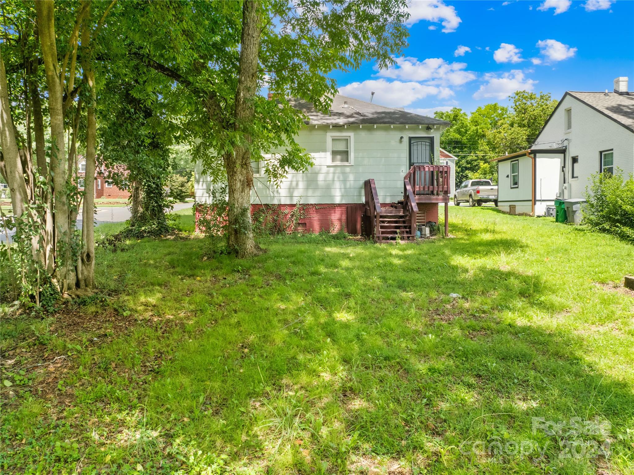 1247 Effingham Road Charlotte, NC 28208 - Photo 19 of 19 a view of a house with backyard and sitting area