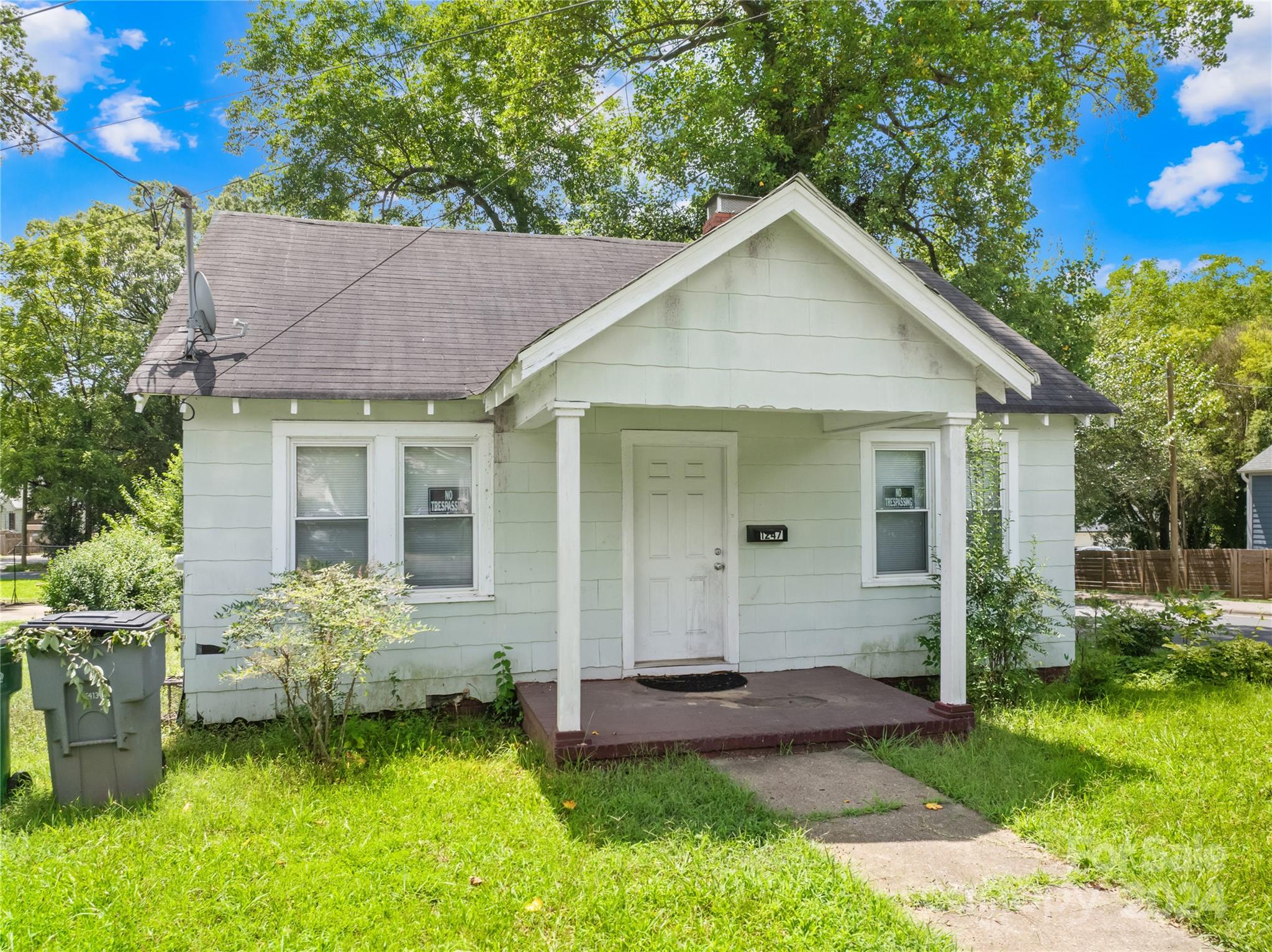 1247 Effingham Road Charlotte, NC 28208 - Photo 3 of 19 a view of a house with a yard