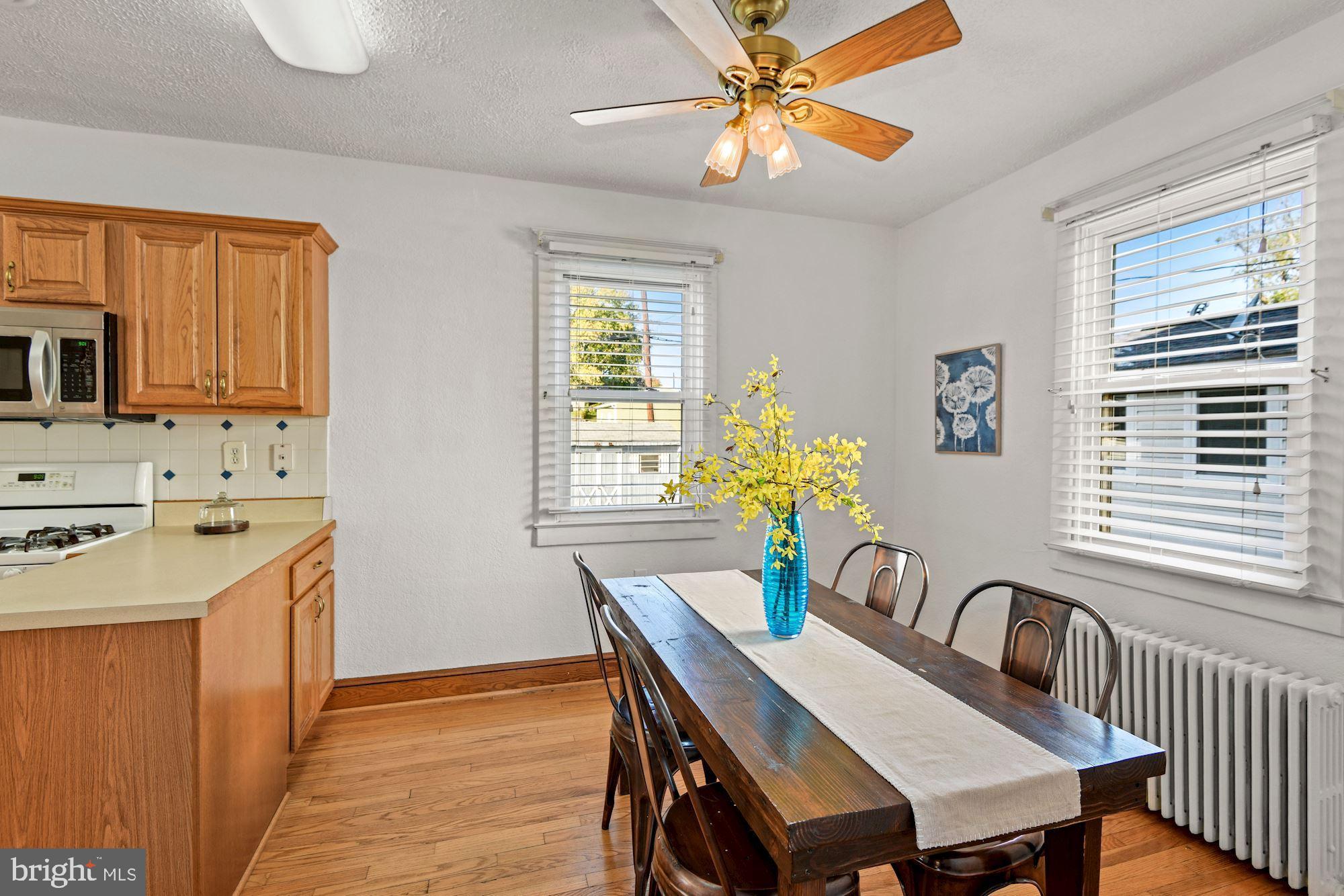 5524 Ashbourne Road Baltimore, MD 21227 - Photo 8 of 23 a view of a dining room with furniture window and wooden floor