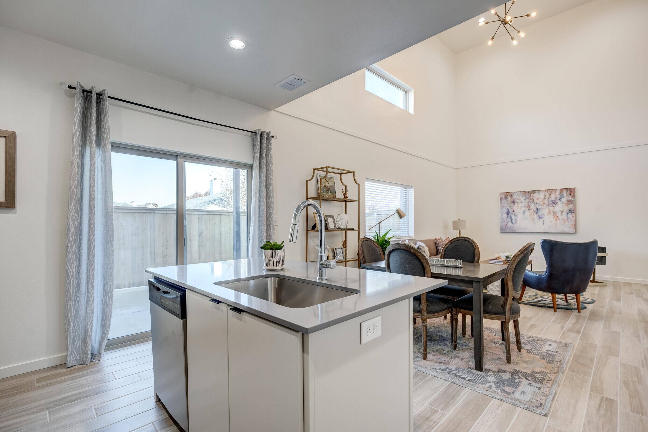 310 Homestead Avenue, Unit 4 Lubbock, TX 79416 - Photo 15 of 29 a kitchen with a table chairs and entryway