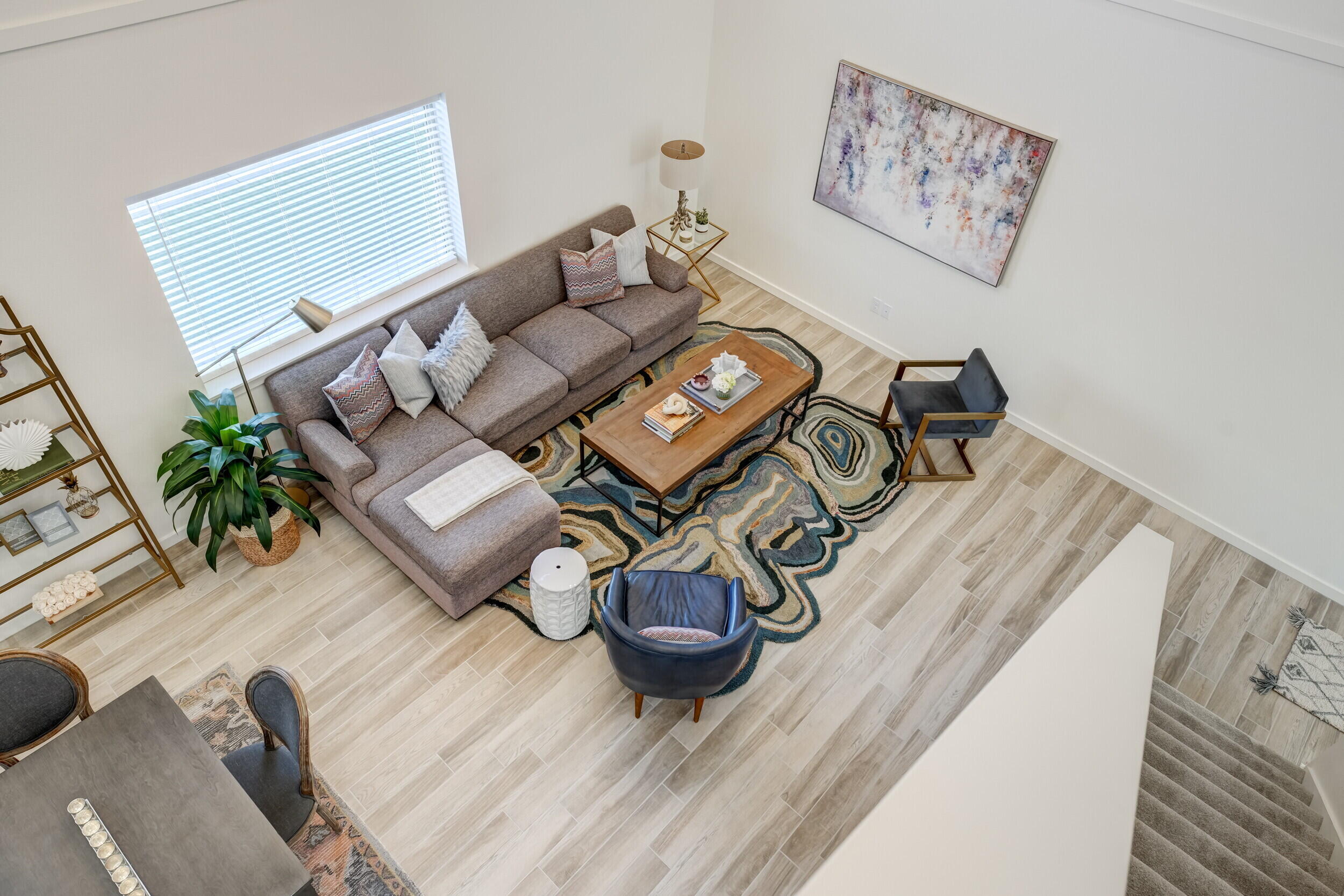 310 Homestead Avenue, Unit 4 Lubbock, TX 79416 - Photo 17 of 29 a living room with furniture and a wooden floor