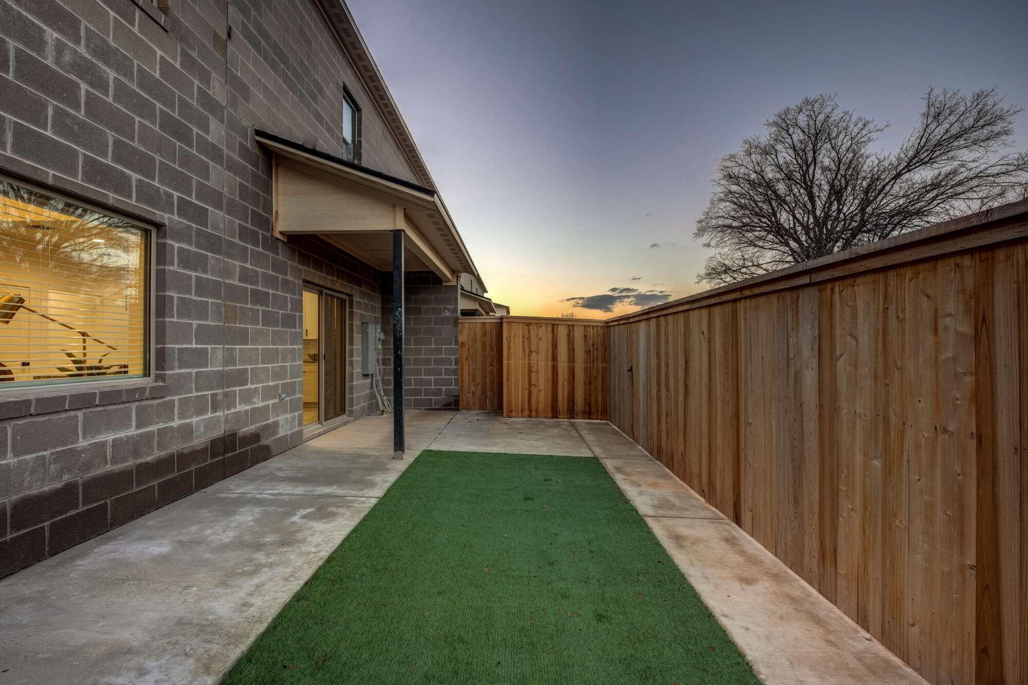 310 Homestead Avenue, Unit 4 Lubbock, TX 79416 - Photo 28 of 29 a view of a backyard with pathway