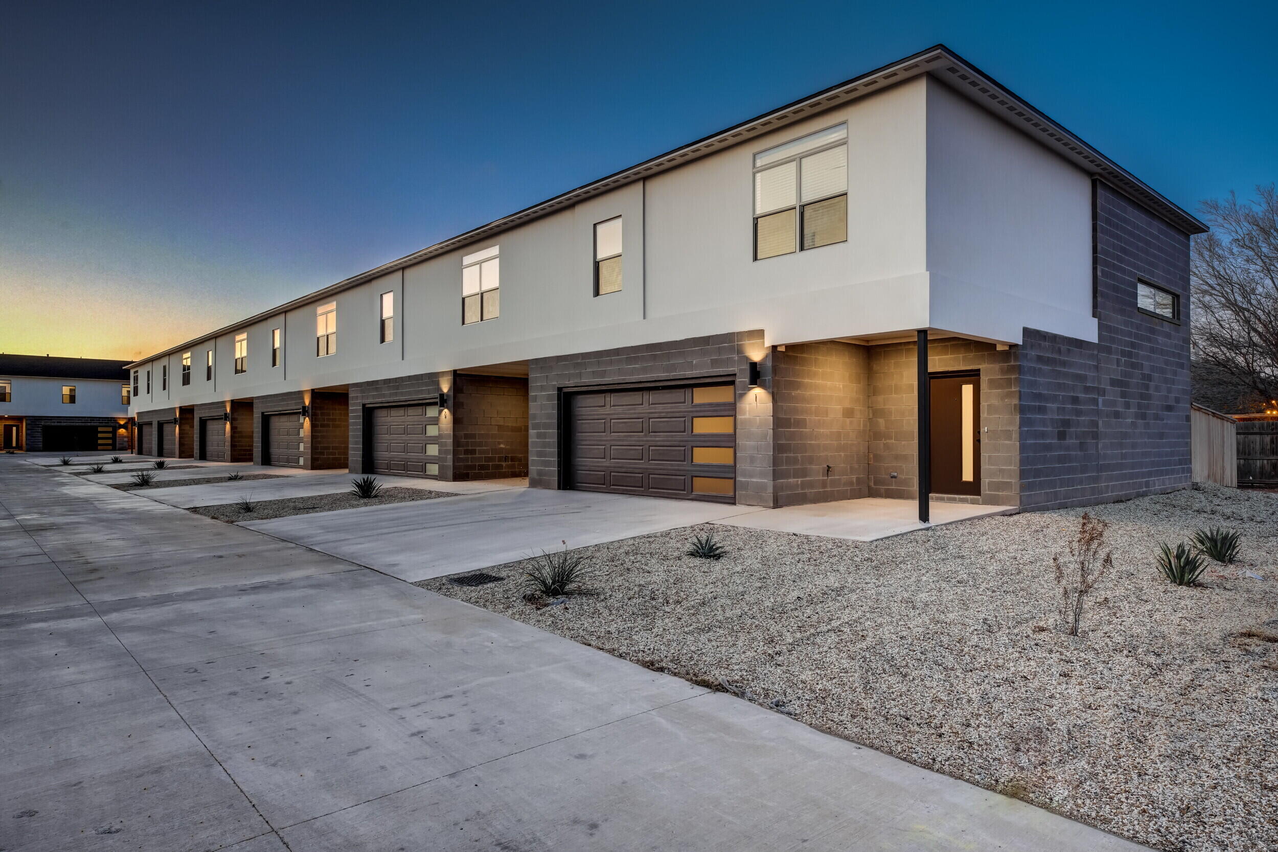 310 Homestead Avenue, Unit 4 Lubbock, TX 79416 - Photo 3 of 29 a front view of a house with a yard and garage