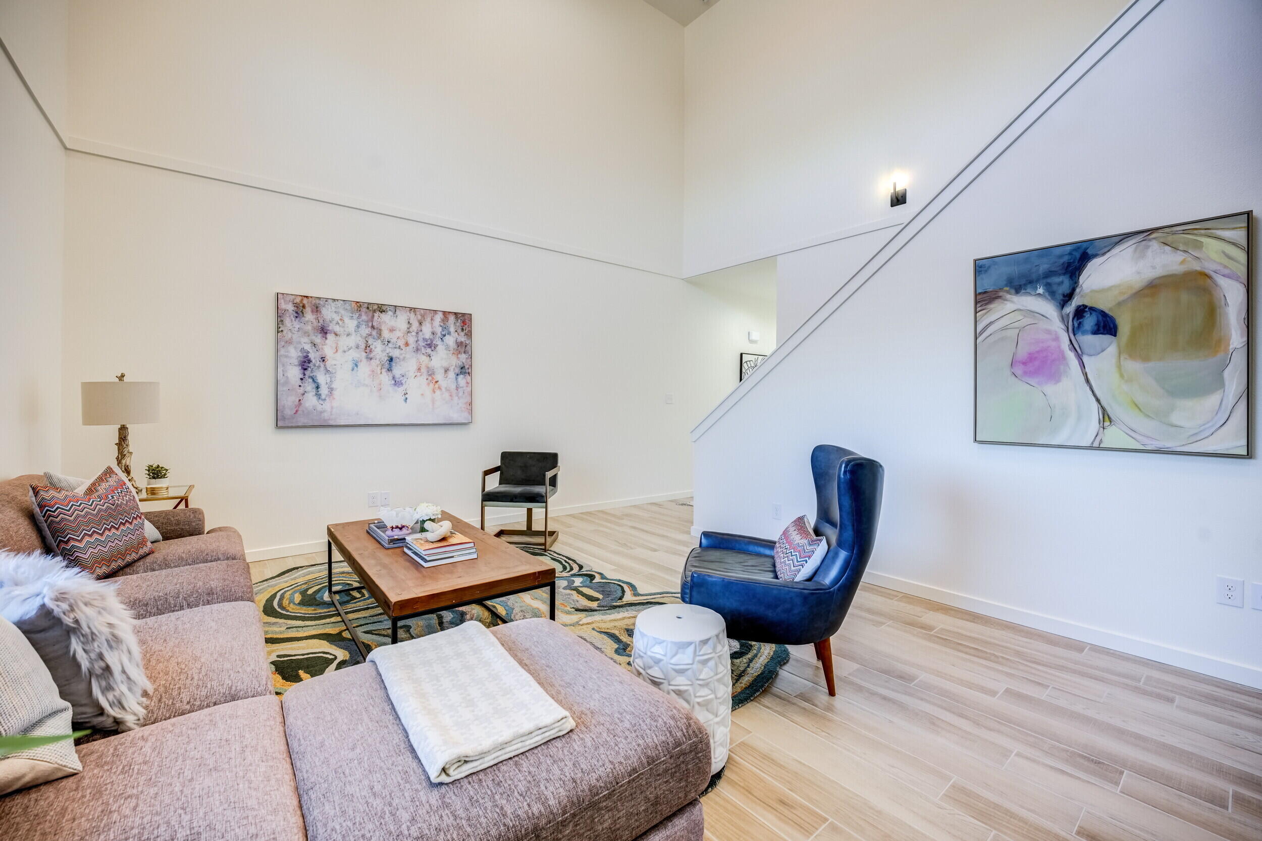 310 Homestead Avenue, Unit 4 Lubbock, TX 79416 - Photo 9 of 29 a living room with furniture and a painting on the wall