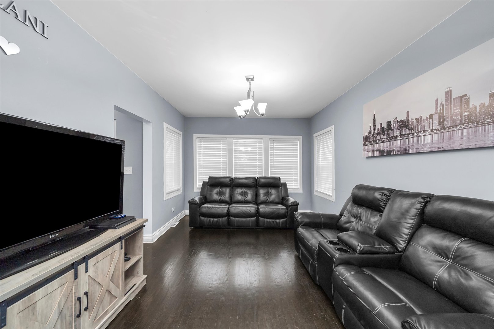 5837 West 16th Street Cicero, IL 60804 - Photo 3 of 22 a living room with furniture and a flat screen tv