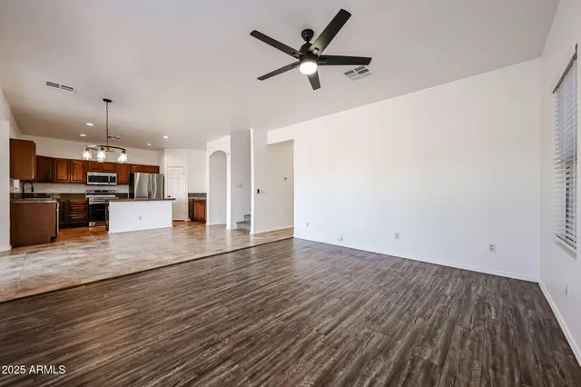 a view of a kitchen with a sink and a stove top oven