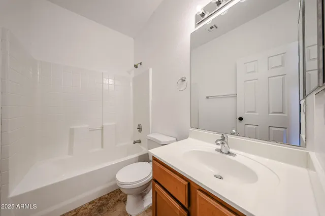 a bathroom with a sink toilet tub and shower