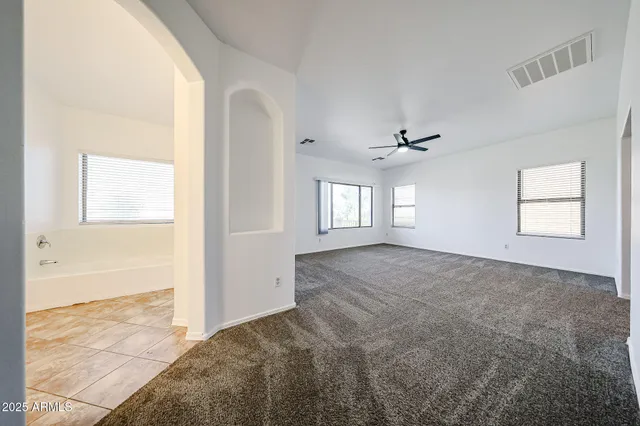a view of an empty room with a window