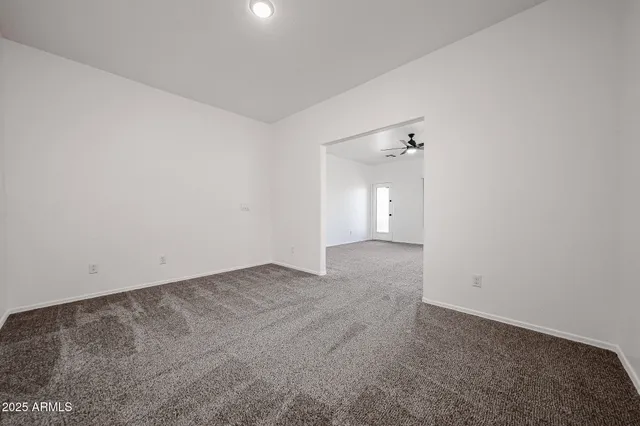 a spacious bathroom with a double vanity sink and a mirror
